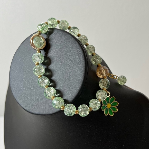 2/$15 sale. Green Beaded Stretch Bracelet with Flower Charm & hanging bead charm - Picture 3 of 5